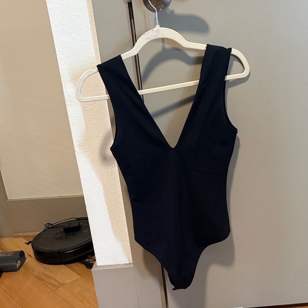 Free people Black V-Neck One-Piece bodysuit